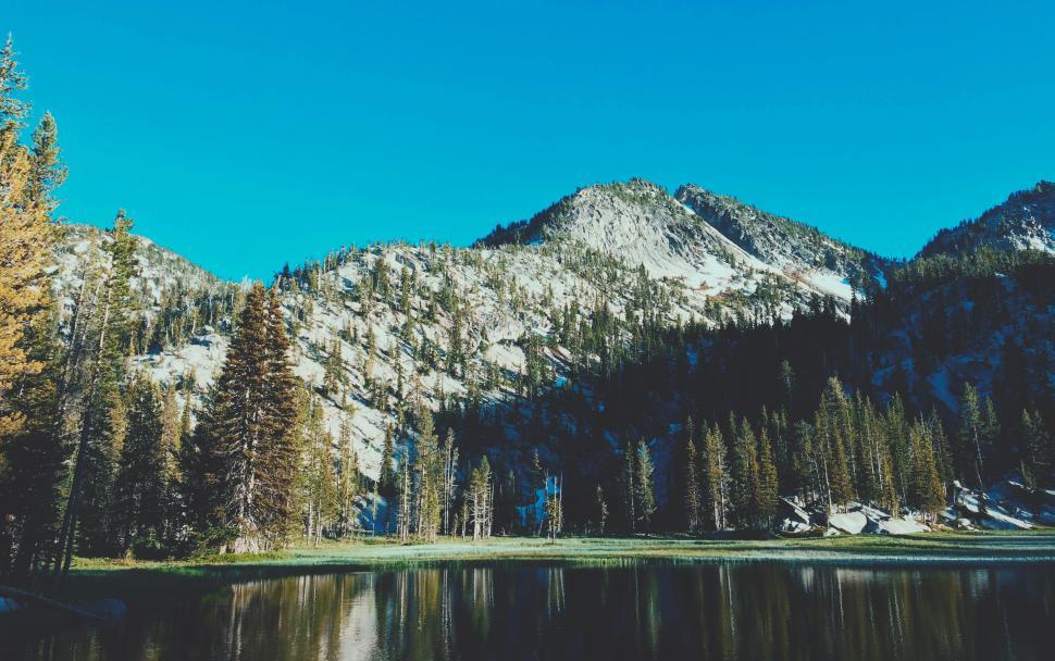 Free Image of Majestic Mountain Range and Lake in Foreground 