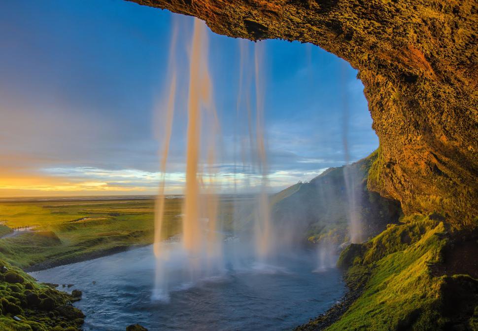 Free Image of Group of Water Spewing Out of a Cave 