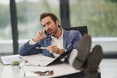 https://freerangestock.com/thumbnail/141863/male-executive-sitting-in-office-with-feet-up-at-the-desk.jpg