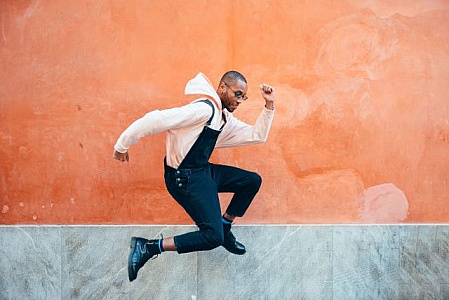 https://freerangestock.com/thumbnail/151709/young-black-man-wearing-casual-clothes-jumping-outdoors.jpg