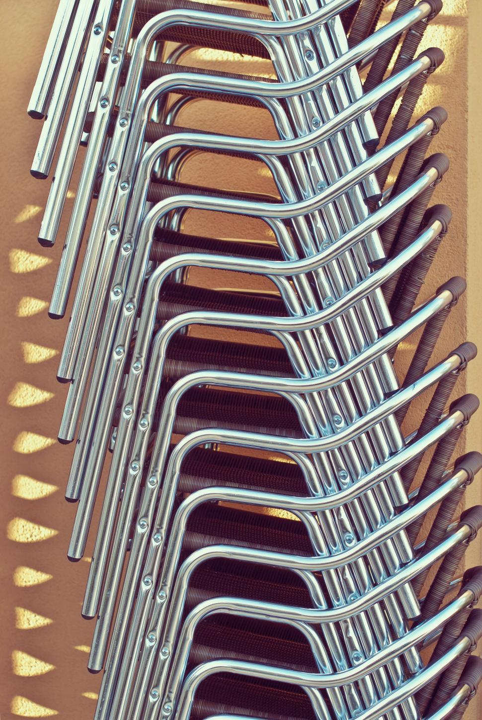 Free Image of Stack of Metal Chairs 