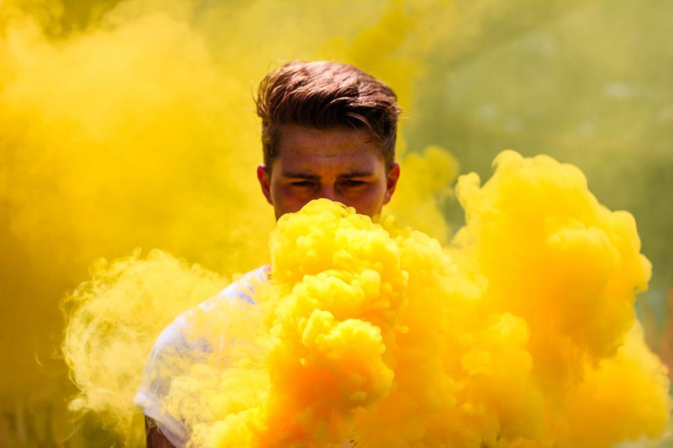 Free Image of Man Covered in Yellow Smoke 