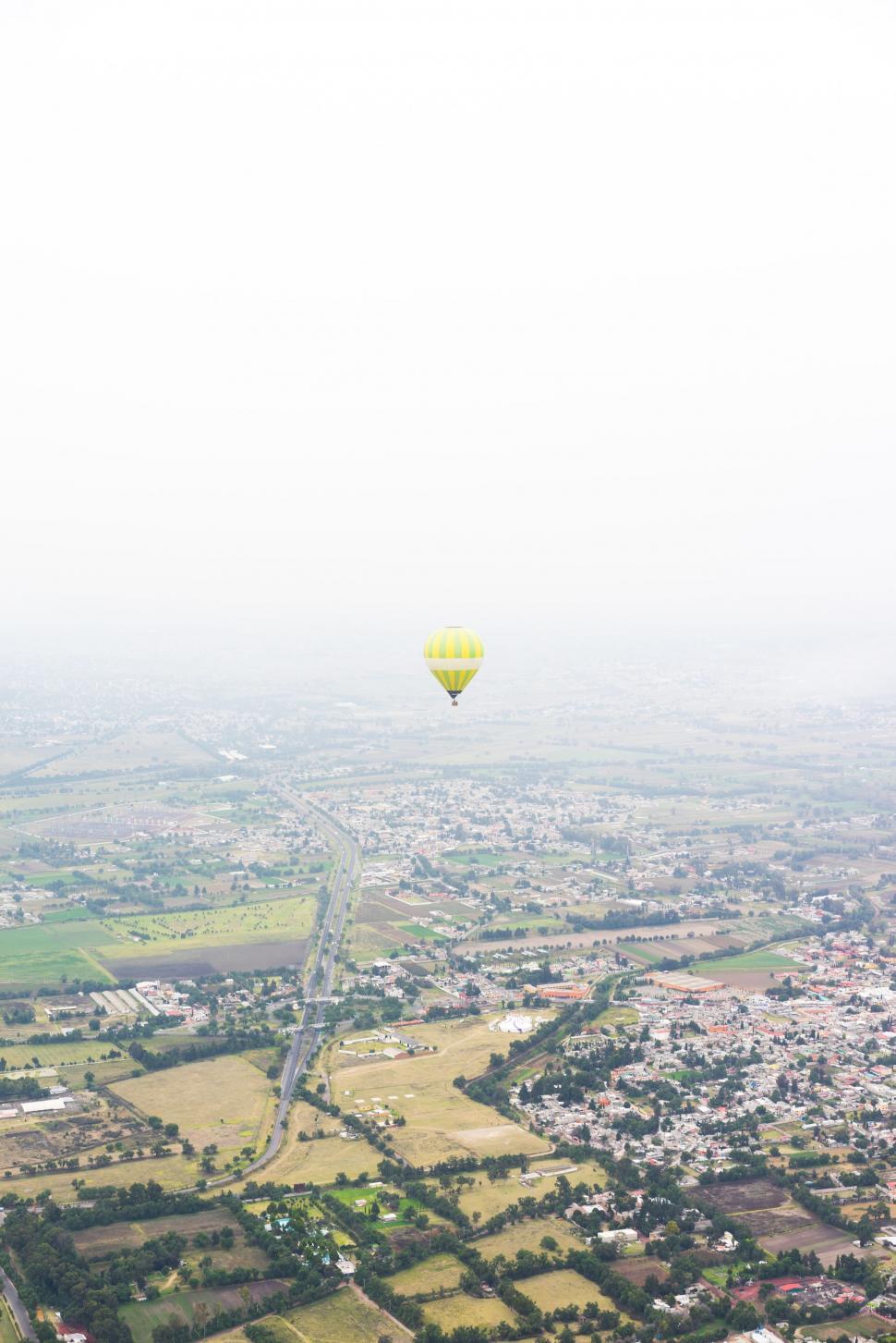 Free Image of Hot Air Balloon Flying Over City 