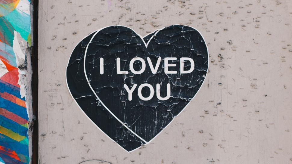 Free Image of A Sticker on the Side of a Building That Says I Loved You 