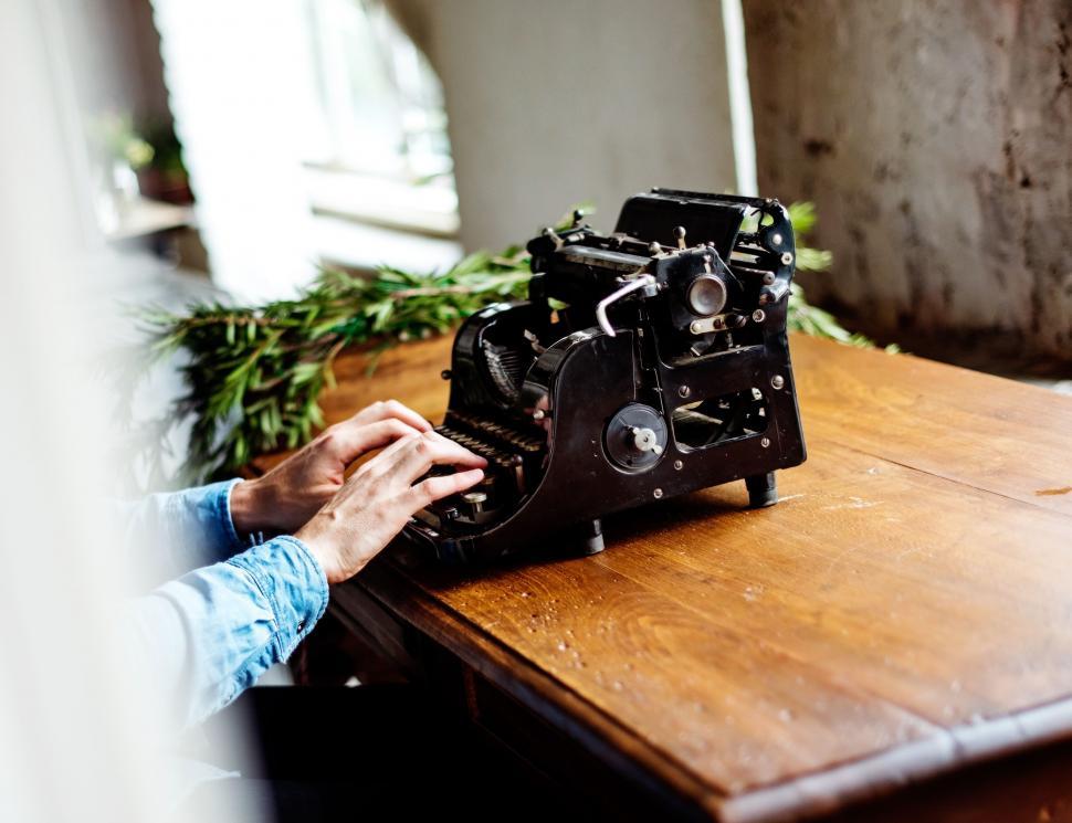 Free Image of Person Typing on an Old Fashioned Typewriter 