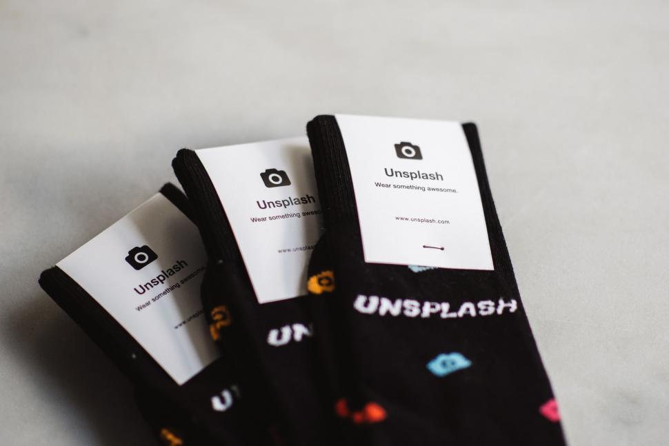 Free Image of Three Pairs of Unsplash Socks Aligned 