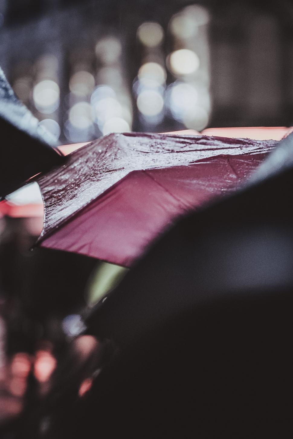 Free Image of People Holding Umbrellas in the Rain 