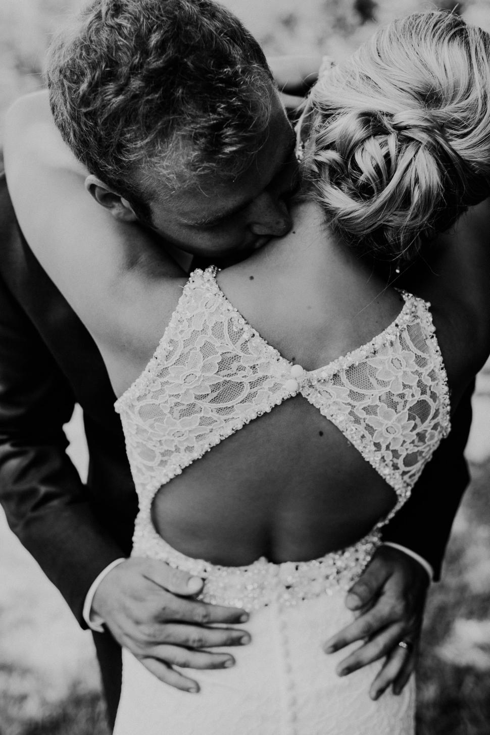 Free Image of Bride and Groom Embracing in Black and White 