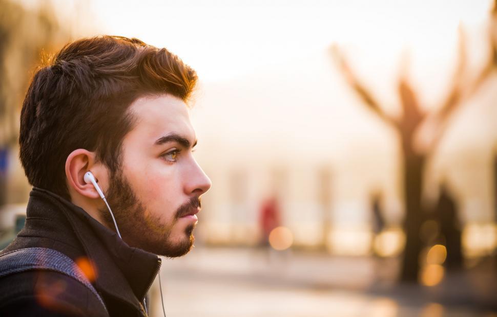 Free Image of Man Listening to Music With Ear Buds 