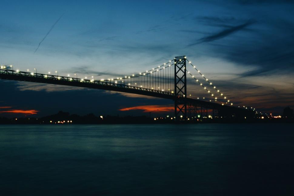 Free Image of Long Bridge Over a Body of Water at Night 