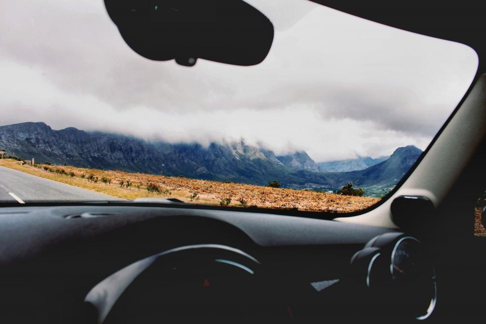 Free Image of Scenic Mountain Road View From Inside Car 