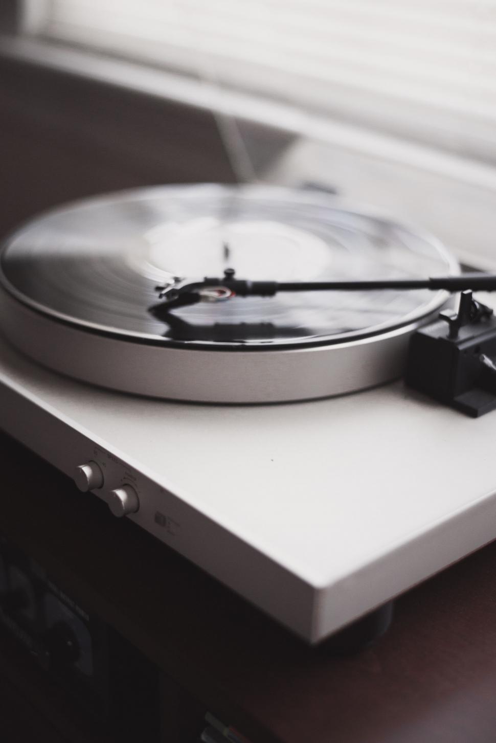 Free Image of Turntable on Table by Window 