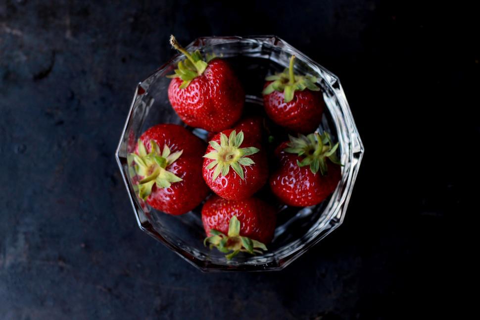 Free Image of Bowl of Strawberries on Dark Surface 