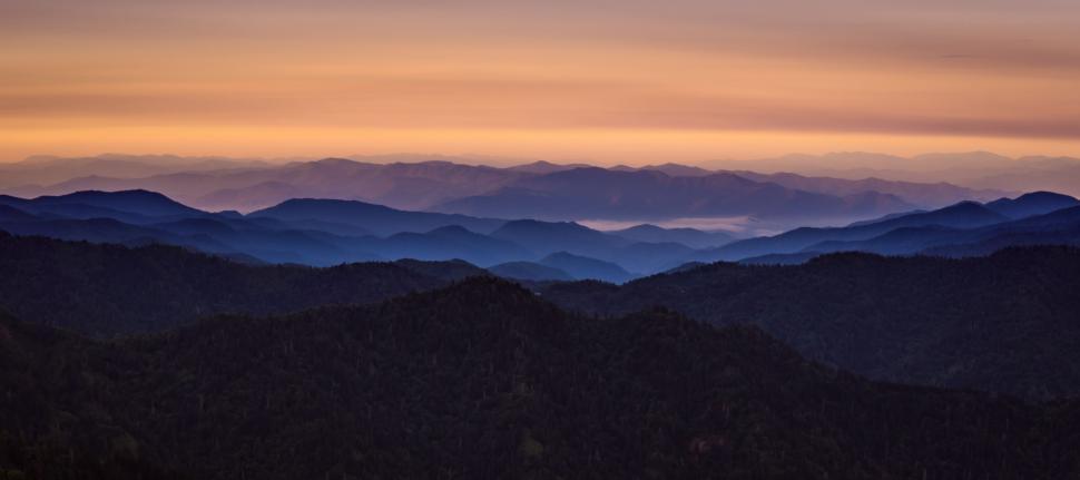 Free Image of Majestic Sunset Over Mountain Range 