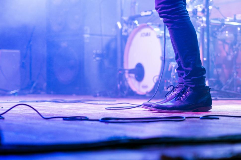 Free Image of Person Standing on Stage With Microphone 
