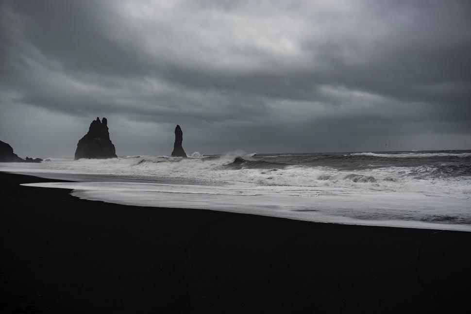 Free Image of Ocean Waves Crashing Against Black Rocks 