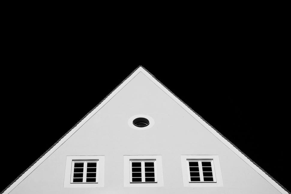 Free Image of White House With Three Windows on Black Background 