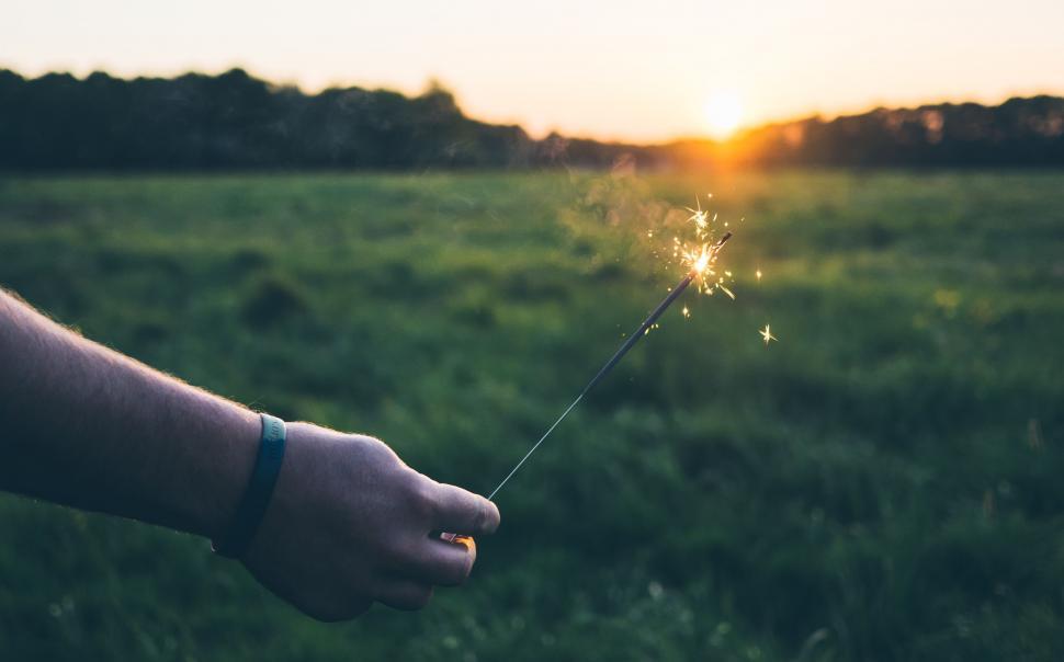 Free Image of Person Holding Sparkler in Field 