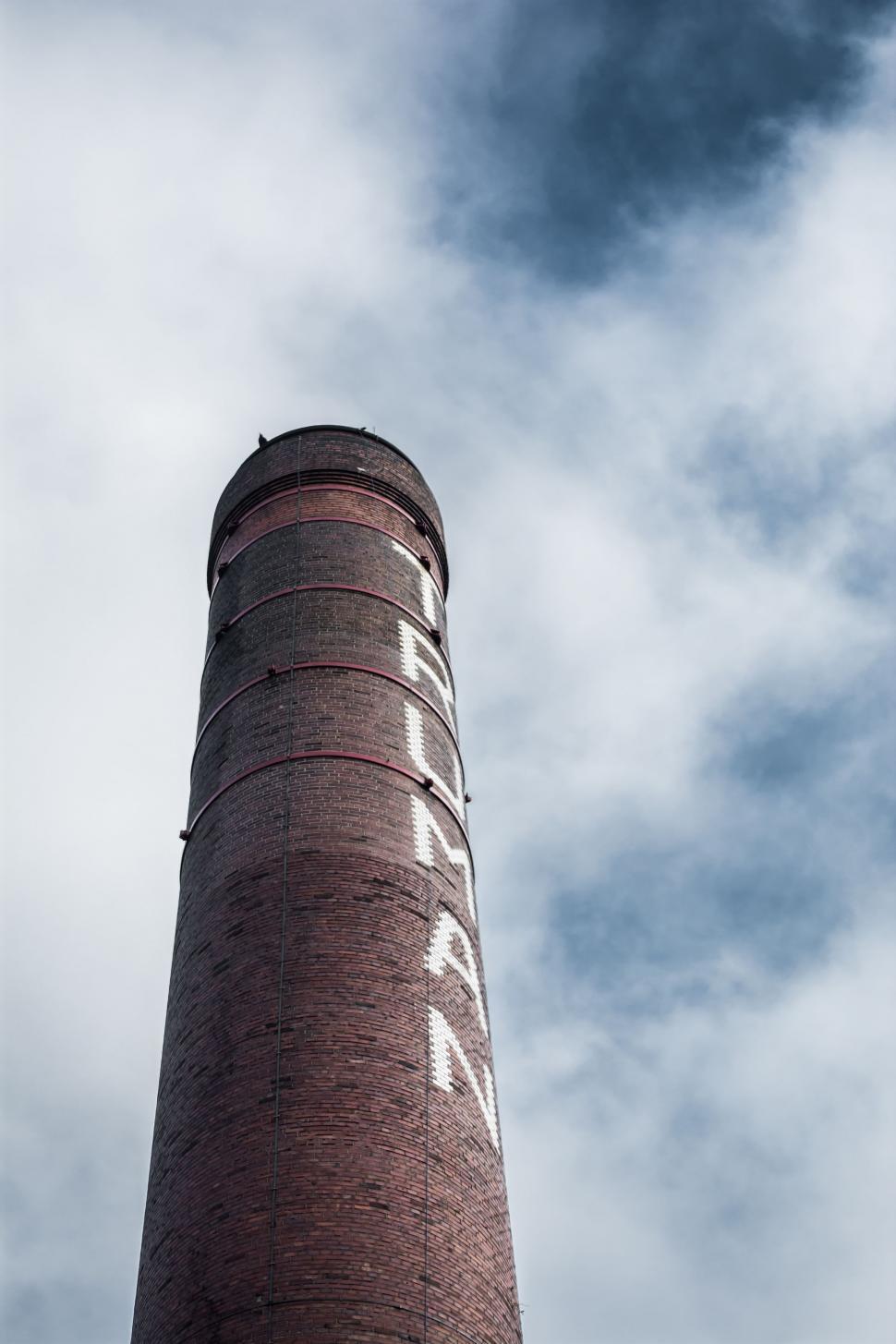 Free Image of Tall Brick Tower Against Sky 