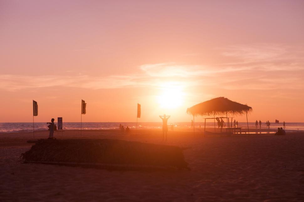 Free Image of People on Beach Watching Sunset 