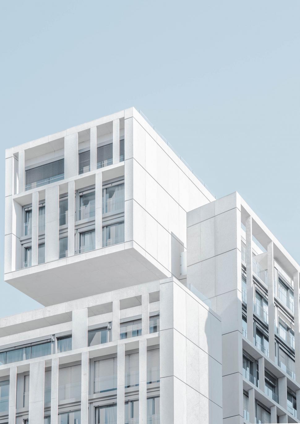 Free Image of Modern White Building With Windows and Balconies 