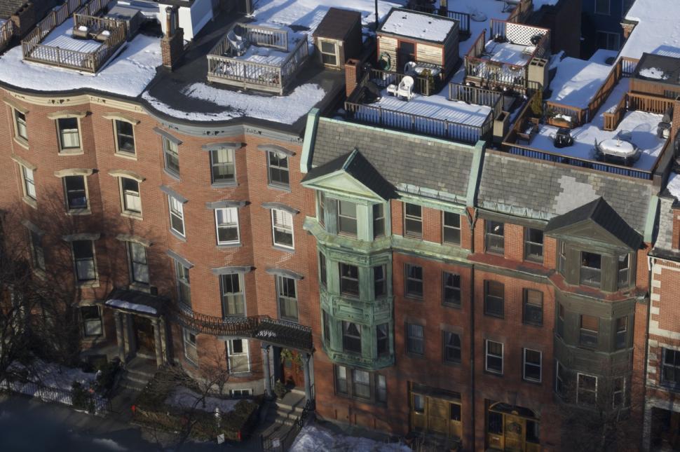 Free Image of Aerial View of Building With Snow-Covered Roof 