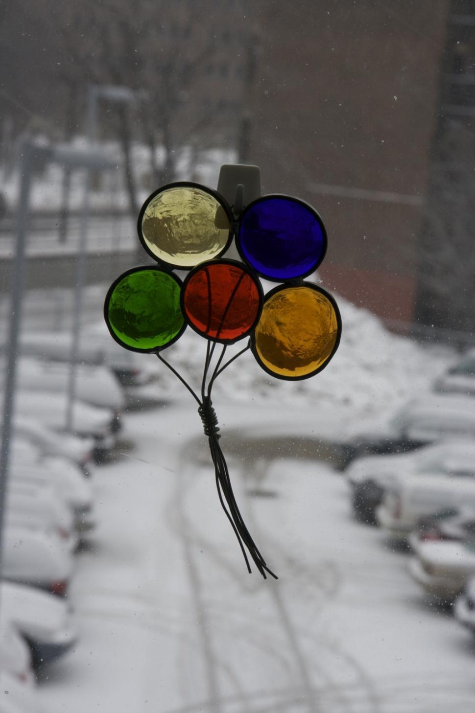 Free Image of Colorful Glass Balls Adorning Window 