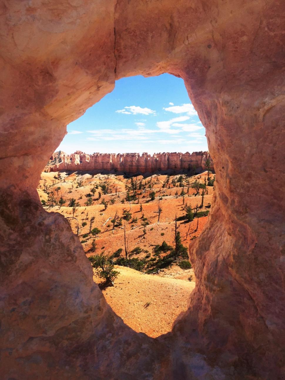 Free Image of Hole in the Rock Overlooking Desert Valley 