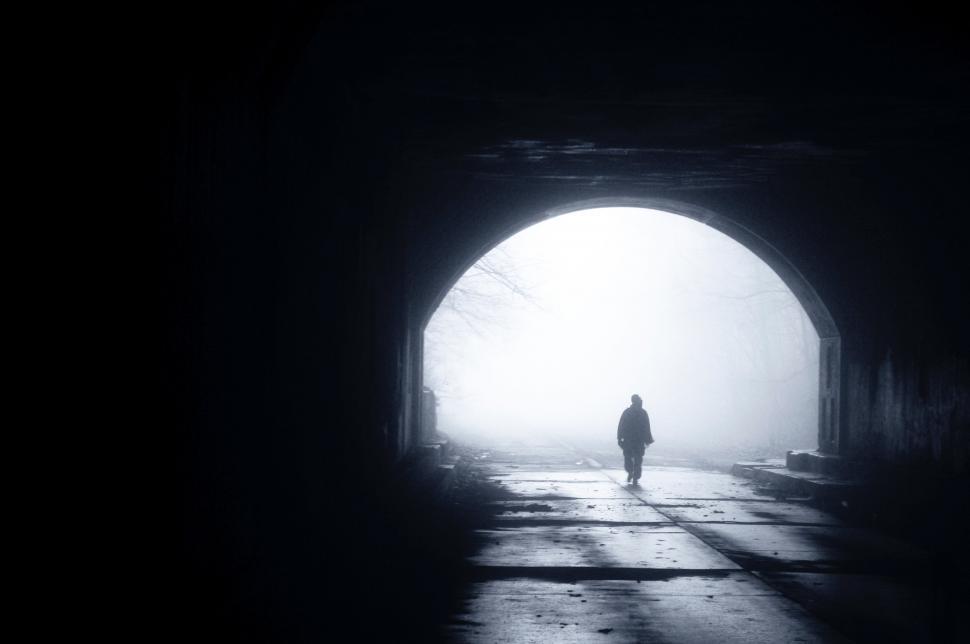 Free Image of Person Emerging From Dark Tunnel 