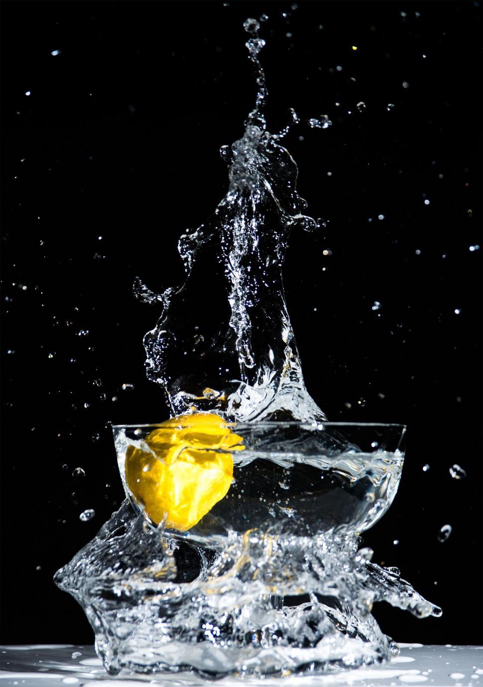 Free Image of Apple Splashing Into Glass of Water 