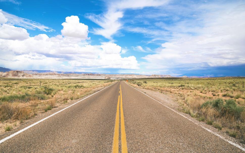 Free Image of Long Straight Road Under a Sky 