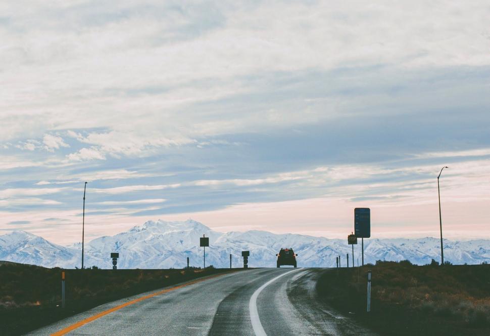 Free Image of Empty Road With Mountains in the Background 
