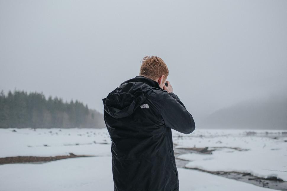 Free Image of Man Talking on Cell Phone in Snow 