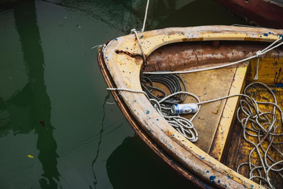 Free Image of Small Boat Tied Up to Dock 