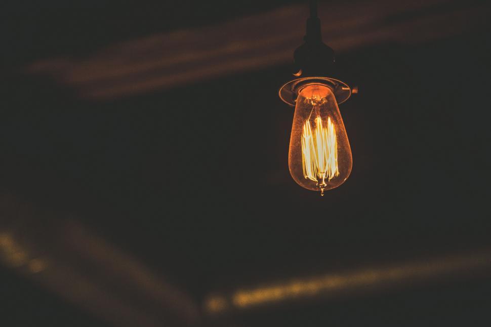 Free Image of Hanging Light Bulb in Dark Room 