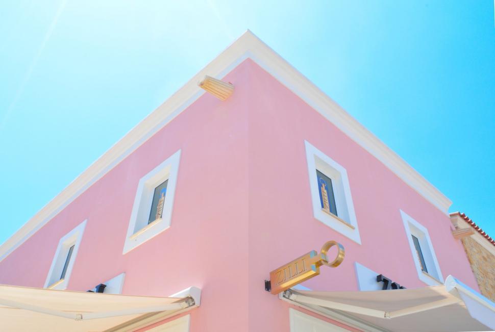 Free Image of Pink House With Key Hanging 