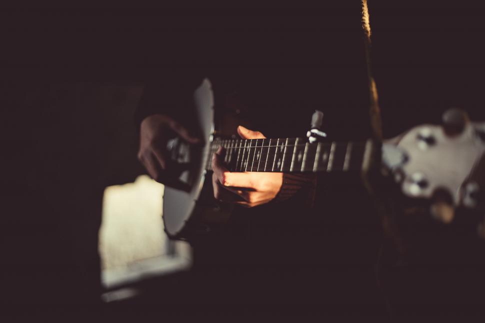 Free Image of Person Playing Guitar in the Dark 