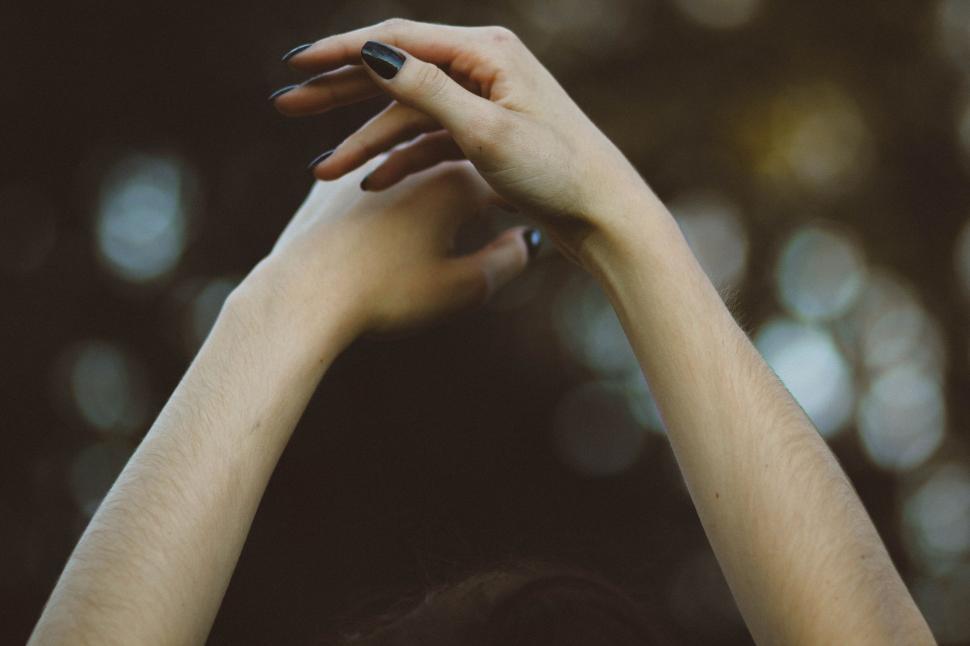 Free Image of Womans Hands Reaching Up Into the Air 