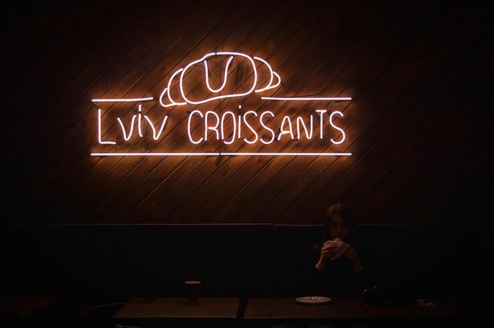 Free Image of Neon Sign Reading Livv Croissants 