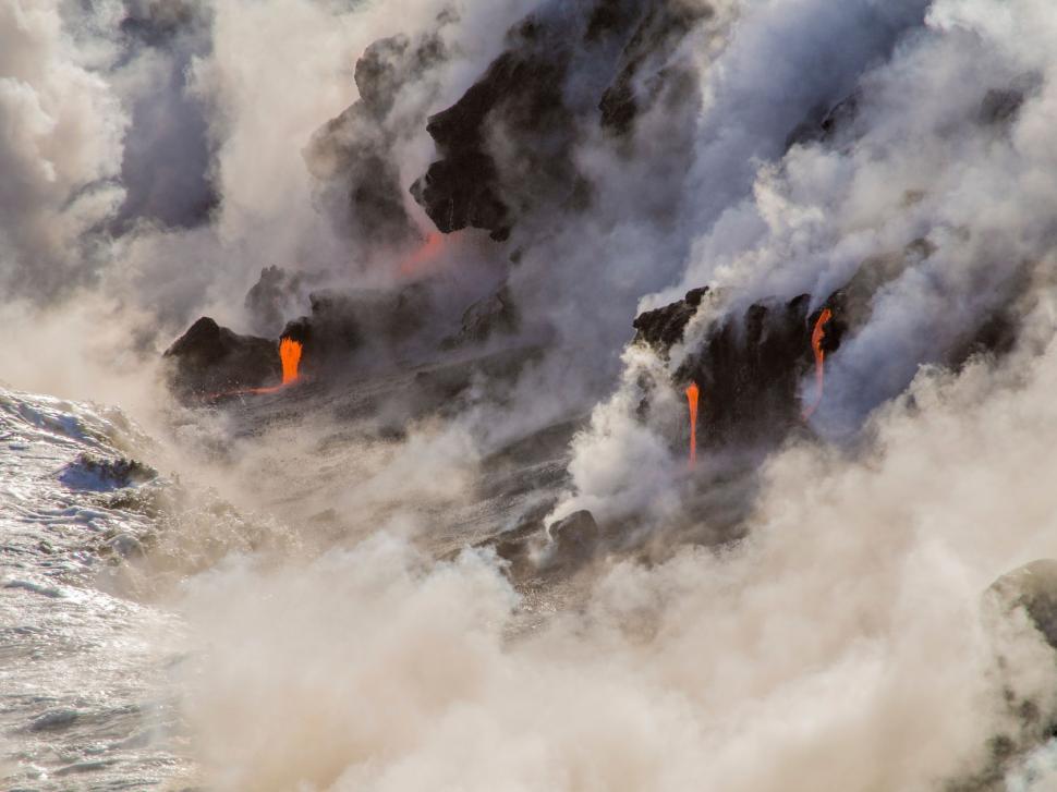 Free Image of Group of Lava Formations in the Middle of the Ocean 