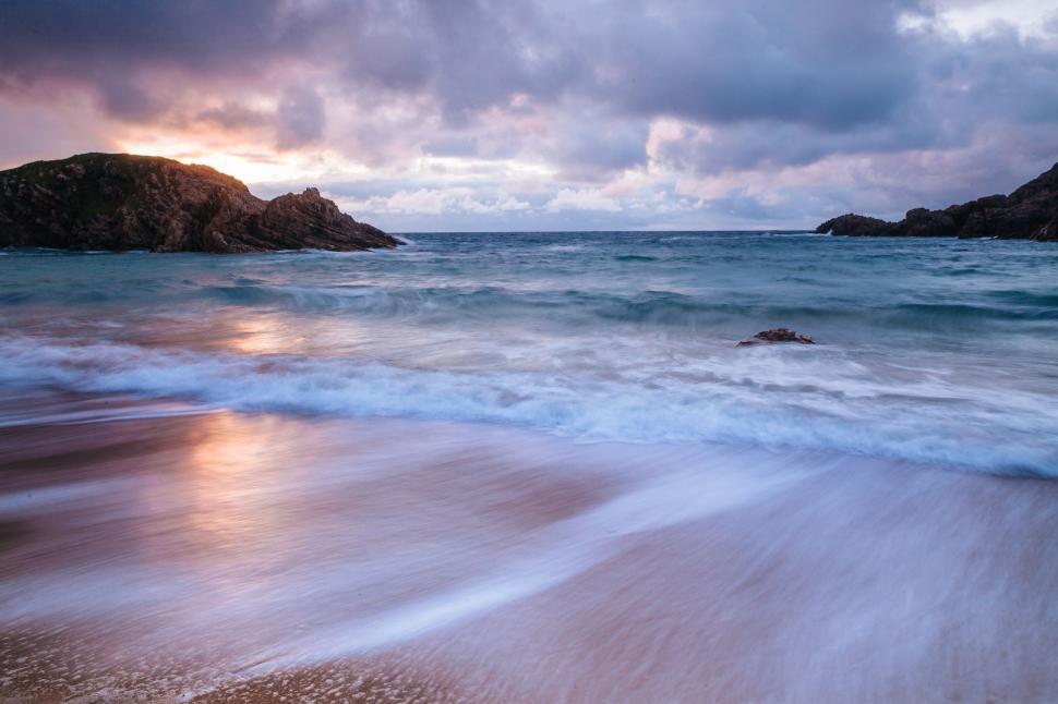 Free Image of Sandy Beach With Waves Rolling In 