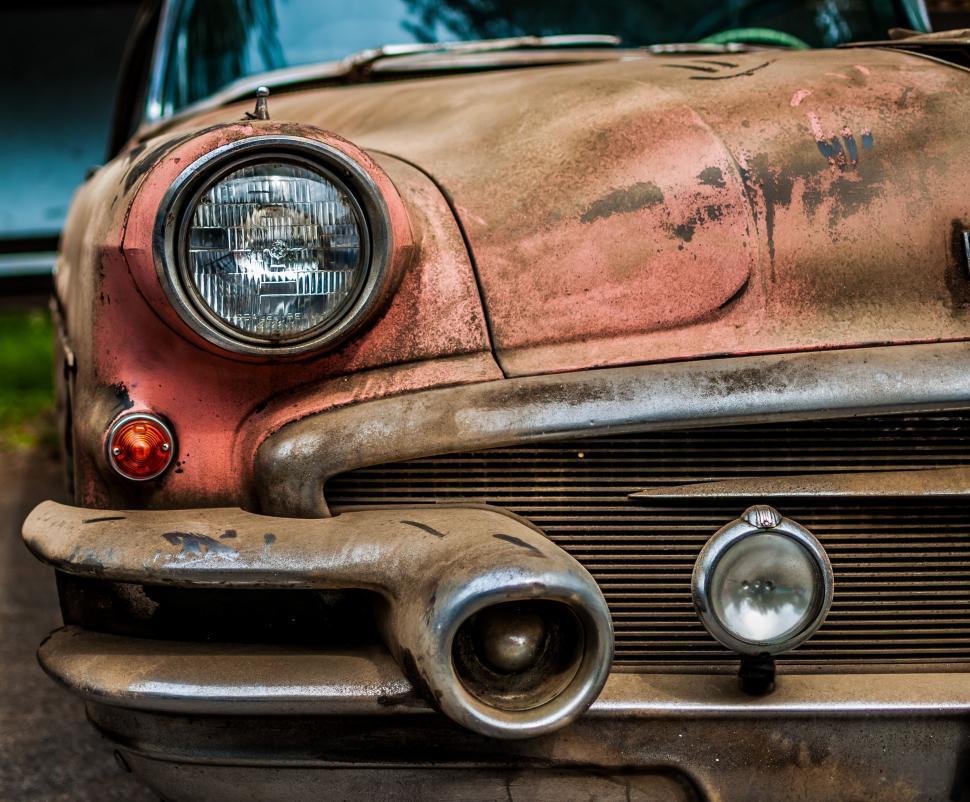 Free Image of Abandoned Rusty Car Parked on Roadside 