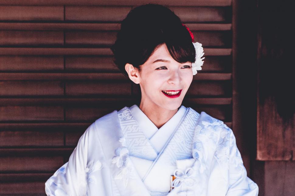 Free Image of Woman in White Kimono Smiling 