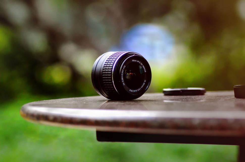 Free Image of Camera Lens on Wooden Table 