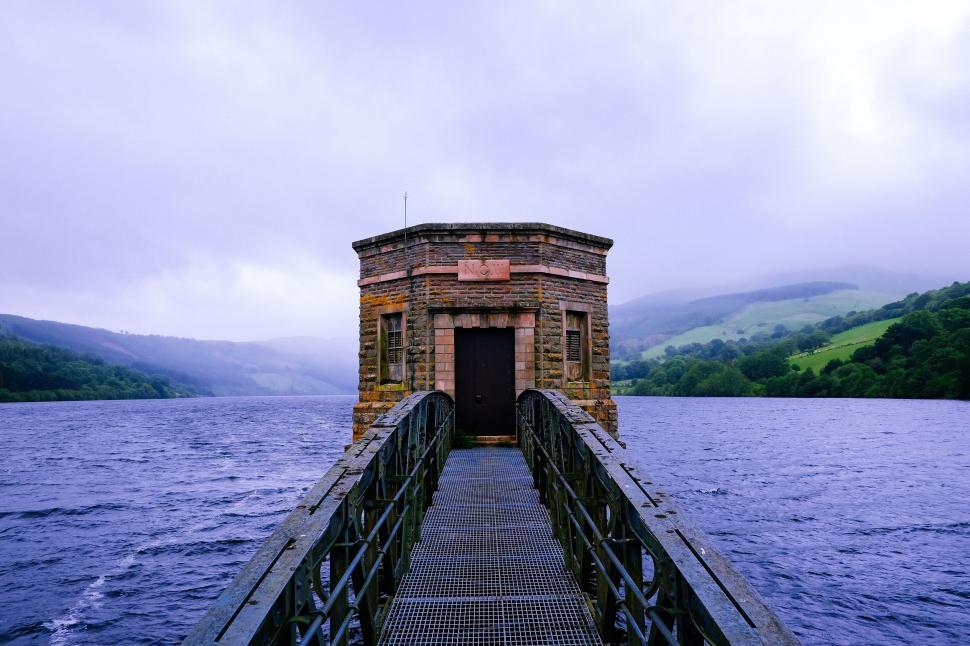 Free Image of Small Building Beside a Body of Water 