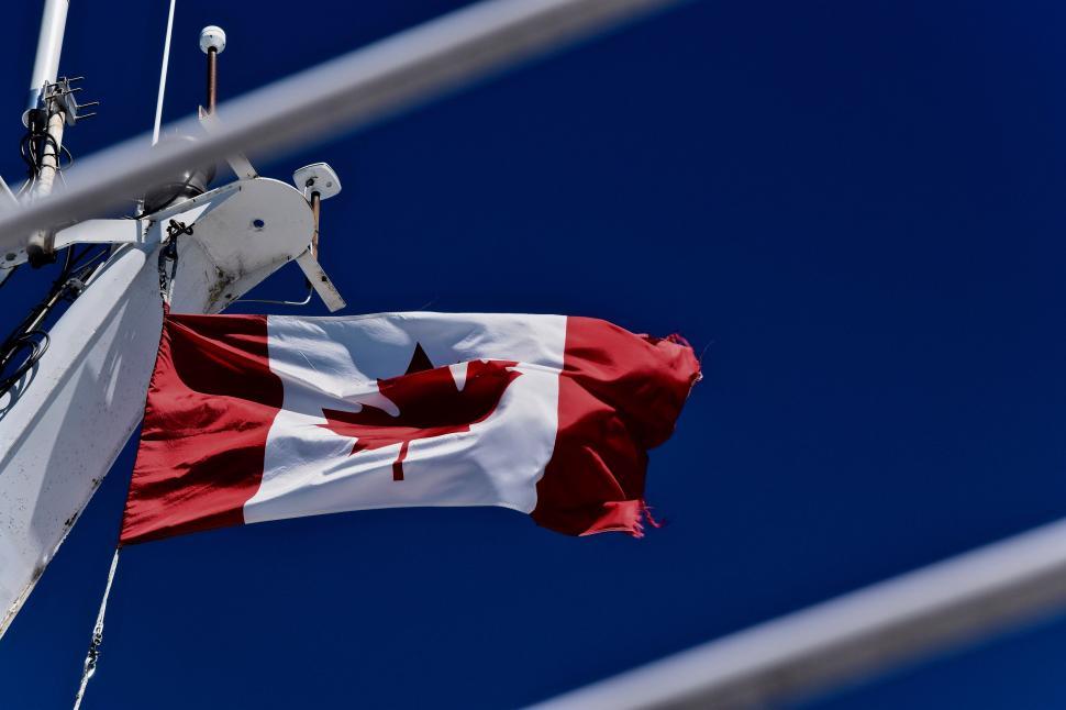Free Image of Canadian Flag Flying on Boat 