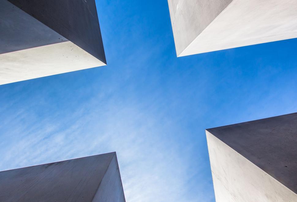 Free Image of Blue Sky With White and Black Shapes 