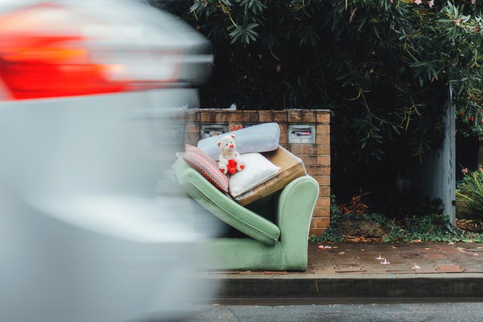 Free Image of Green Chair Abandoned on Roadside 
