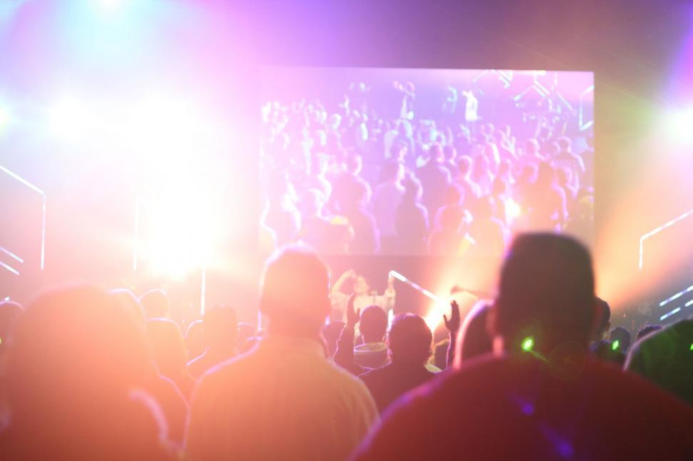 Free Image of Crowd of People Standing in Front of Stage 