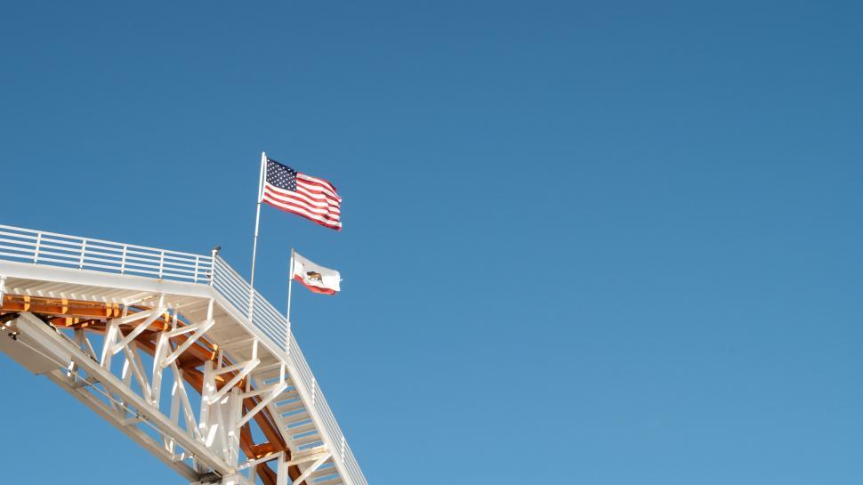Free Image of American Flag Flying on Top of Bridge 